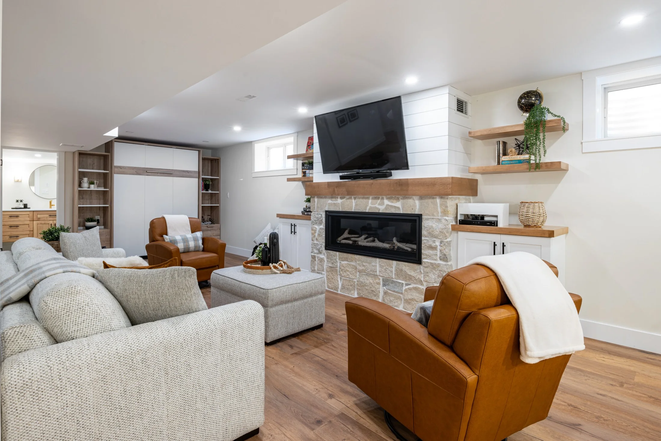 Mill Creek I basement with a sitting area, fireplace and built-in storage