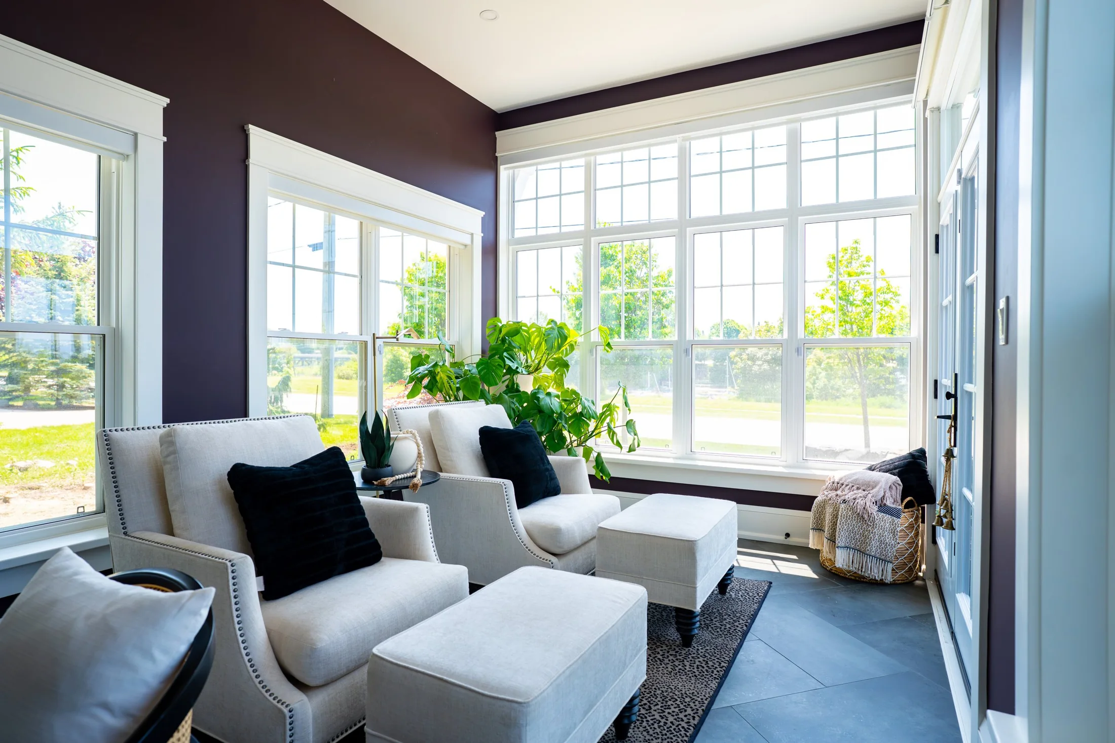 Pair of lounge chairs beside a corner of tall windows at South Rankin II